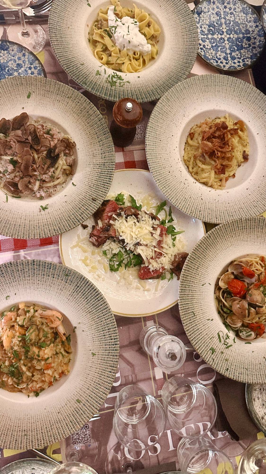 Table of shared Italian pasta dishes